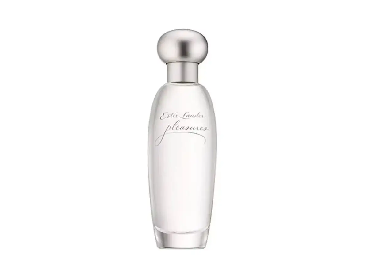 Eleganckie perfumy lat 90 damskie Estée Lauder Pleasures w przezroczystej butelce ze srebrną nakrętką.